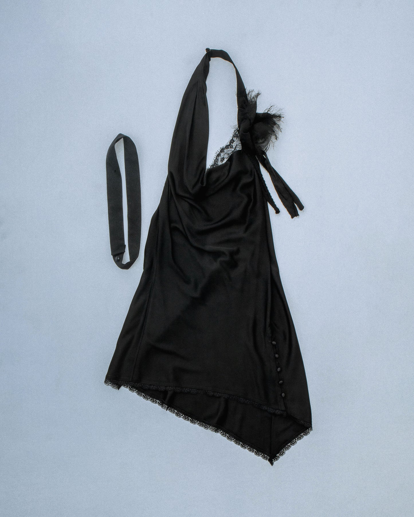 Silk cowl neck mini dress with distressed flower and silk/yarn trims hanging. Fabric is sewn on bias. Features silk buttons to conceal dress slit or cover for a more modest look. Comes with detachable silk snap belt. Deadstock trims from Japan. Perfect for elevated day-to-night looks. Shop now at Sivan Studio.