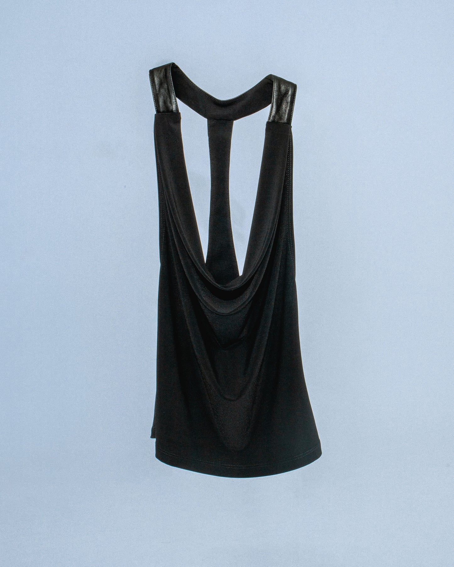 Stretch cowl neck top with lamb leather neck/back halter panel. Leather lined with top material to prevent sticking to skin. Super soft fabric drapes and forms to body. Perfect for elevated day-to-night looks. Shop now at Sivan Studio.