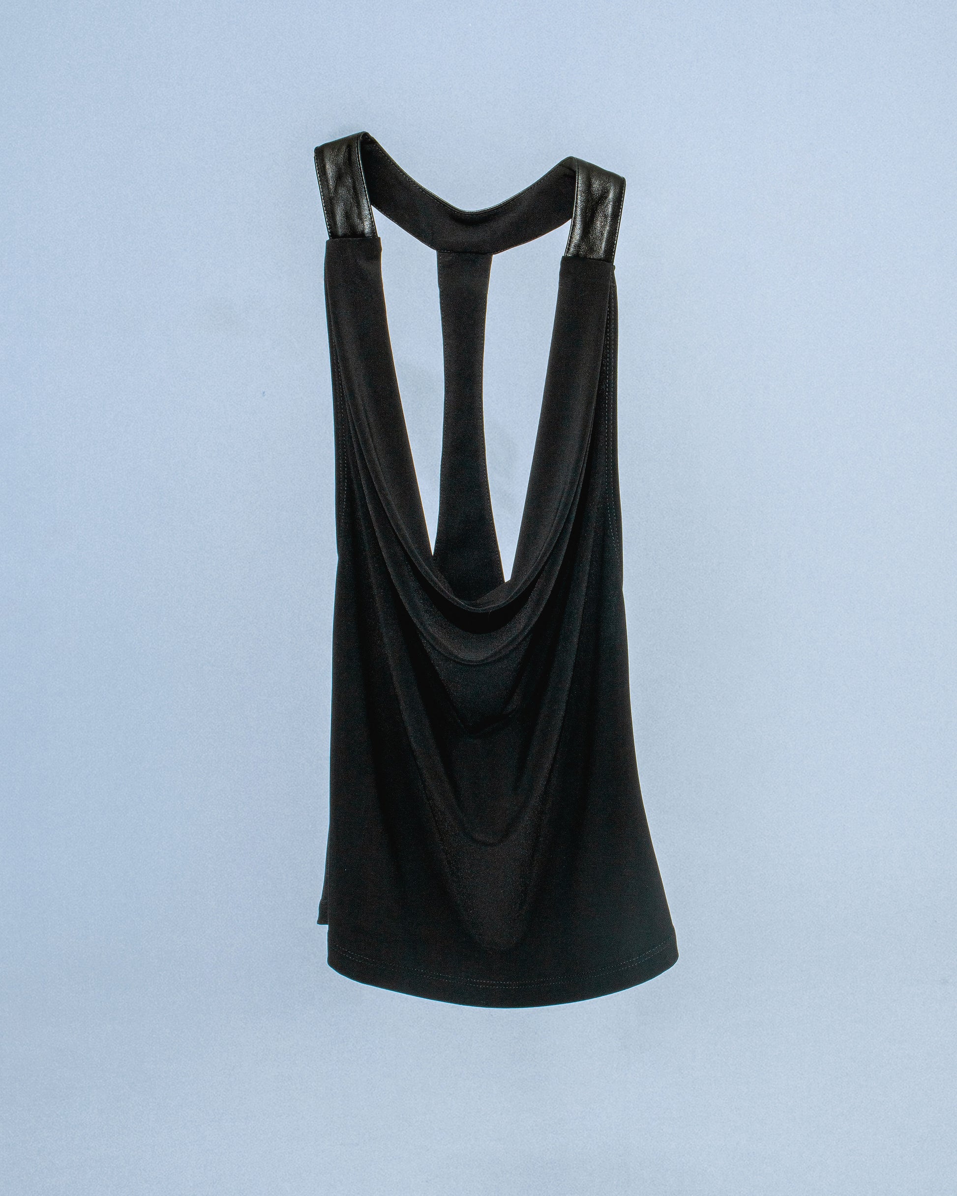 Stretch cowl neck top with lamb leather neck/back halter panel. Leather lined with top material to prevent sticking to skin. Super soft fabric drapes and forms to body. Perfect for elevated day-to-night looks. Shop now at Sivan Studio.