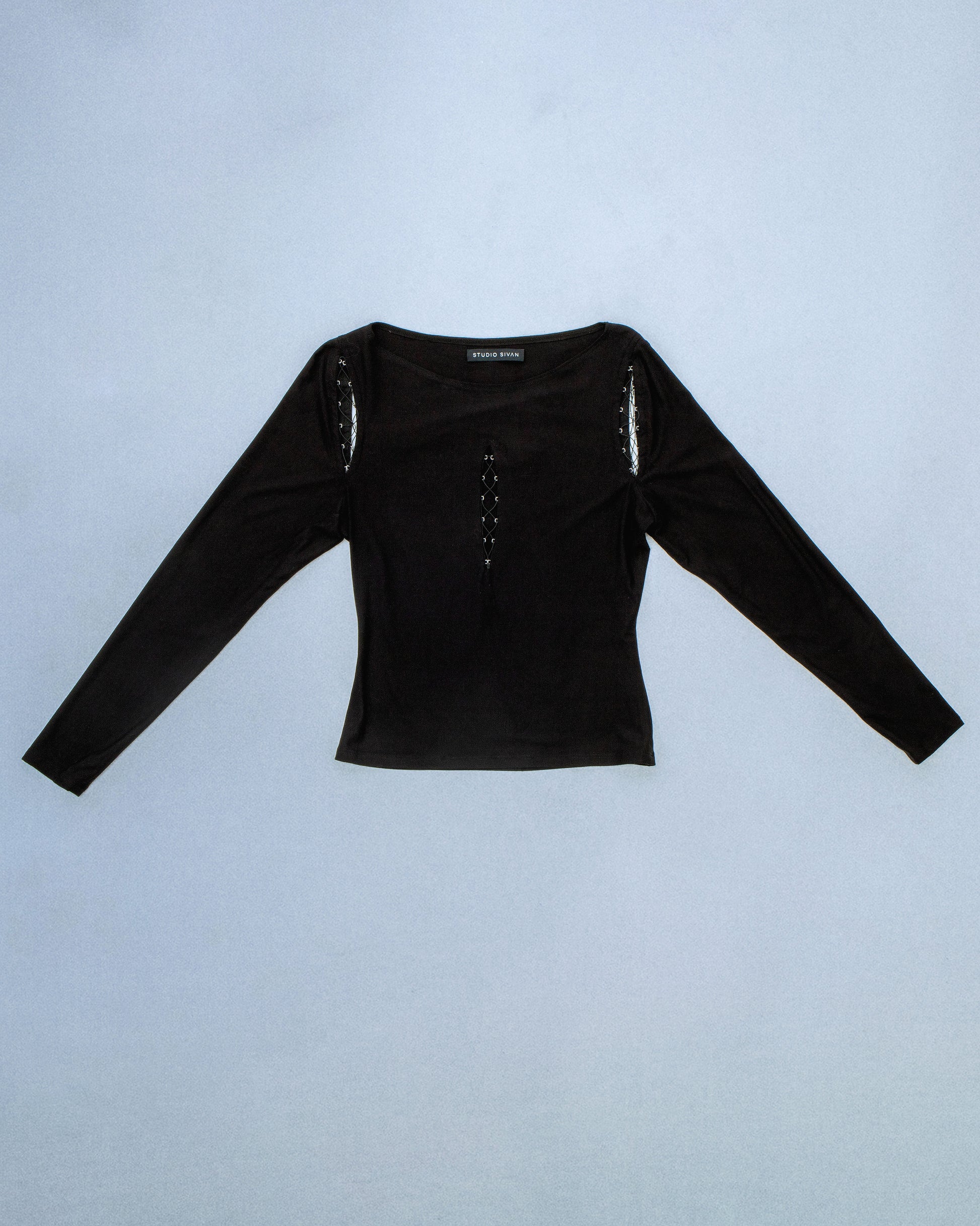 Long sleeve boat neck top made of anti-pill Jersey. Concealed Hook eye tape for lace up design. Stretch elastic thread for lace up. Perfect for elevated day-to-night looks. Shop now at Sivan Studio.