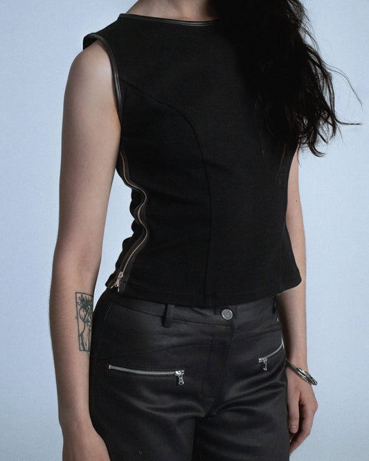 Ponte stretch tank top with lamb leather binding. Princess seams to hug figure. Features side seam zippers and back zipper. Sleeves and neckline also wrapped in leather. Perfect for elevated day-to-night looks. Shop now at Sivan Studio.