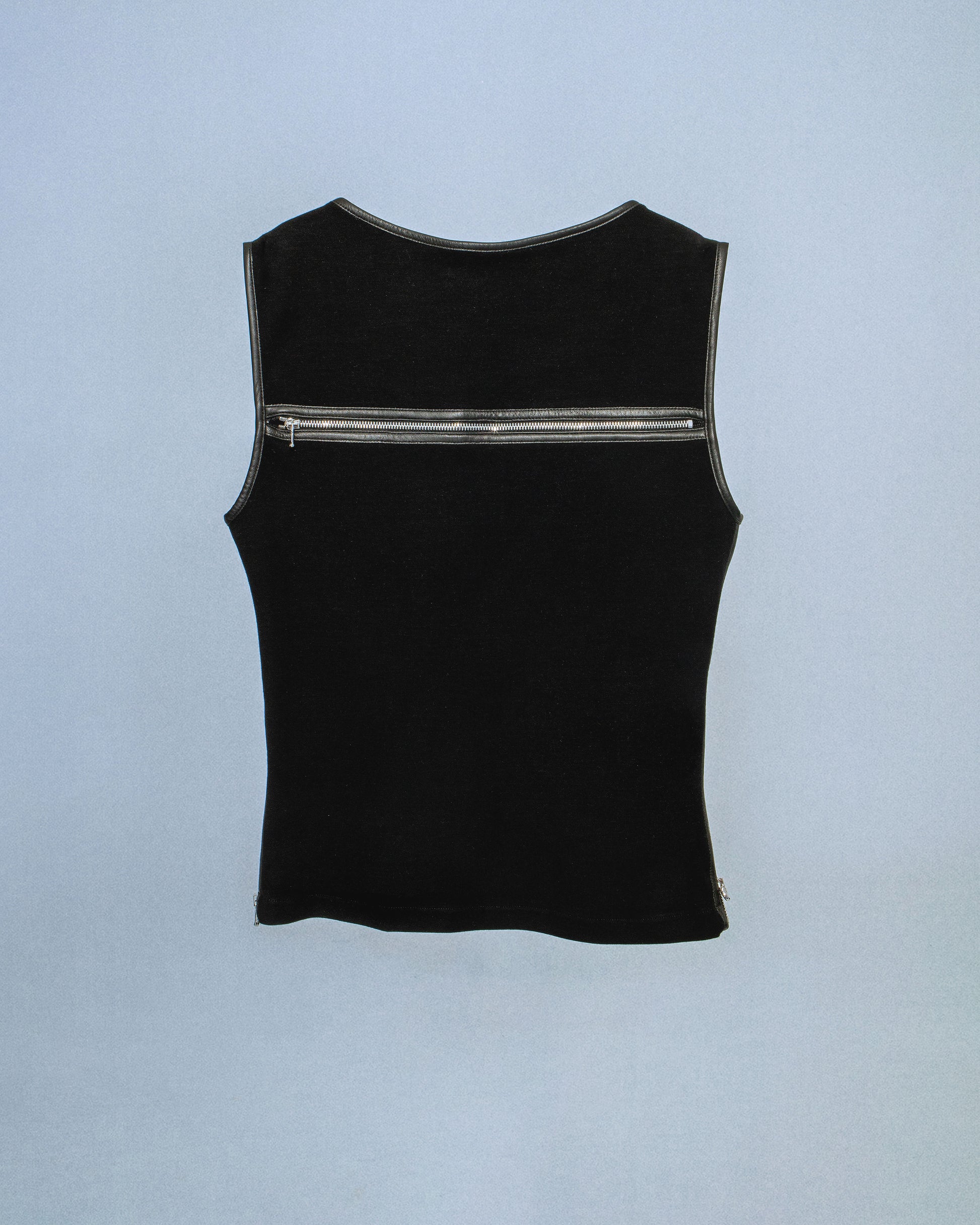 Ponte stretch tank top with lamb leather binding. Princess seams to hug figure. Features side seam zippers and back zipper. Sleeves and neckline also wrapped in leather. Perfect for elevated day-to-night looks. Shop now at Sivan Studio.
